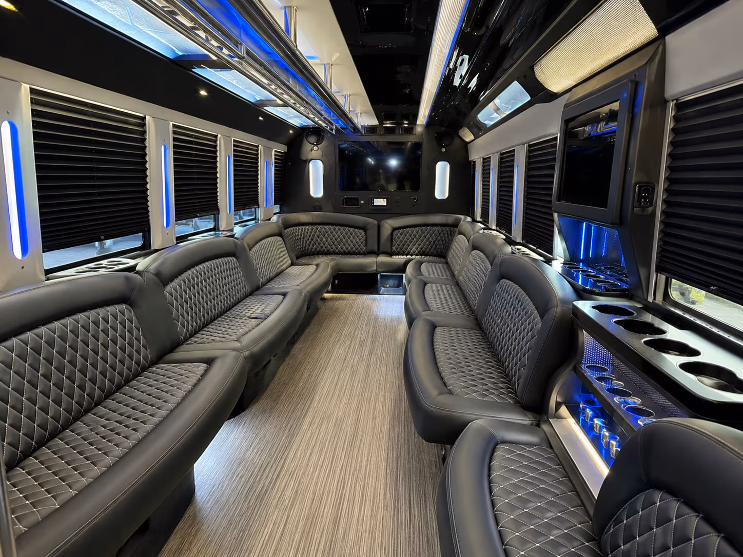 Friends laughing during a party bus celebration in Lexington